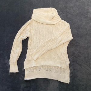 Small woman’s white turtle neck sweater, has a small pull in one of the sleeves.